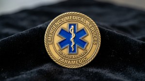 Custom EMS paramedic challenge coin with blue Star of Life emblem on antique gold plating, 1.75 inch round for first responder recognition